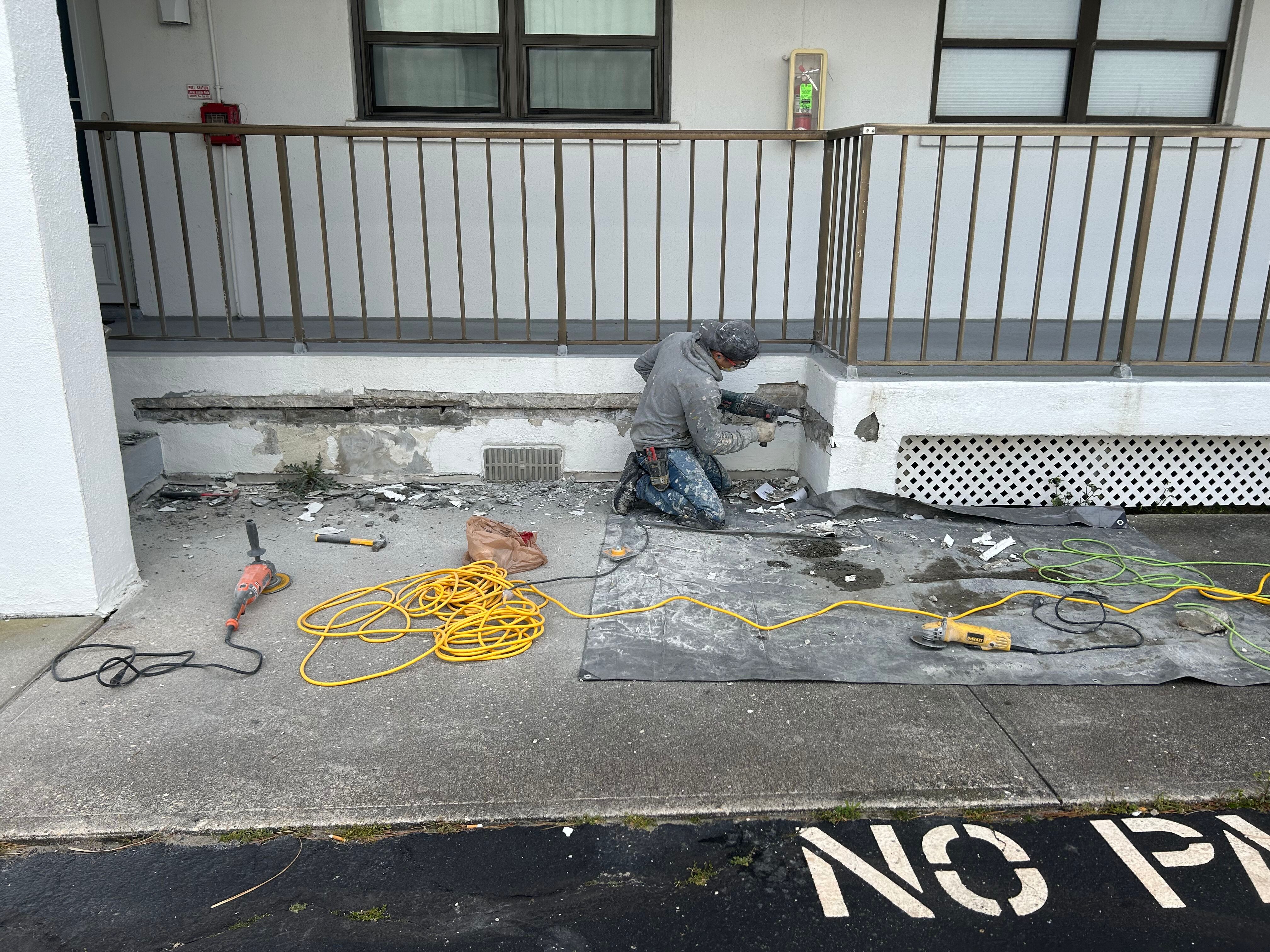 man doing construction on a deck